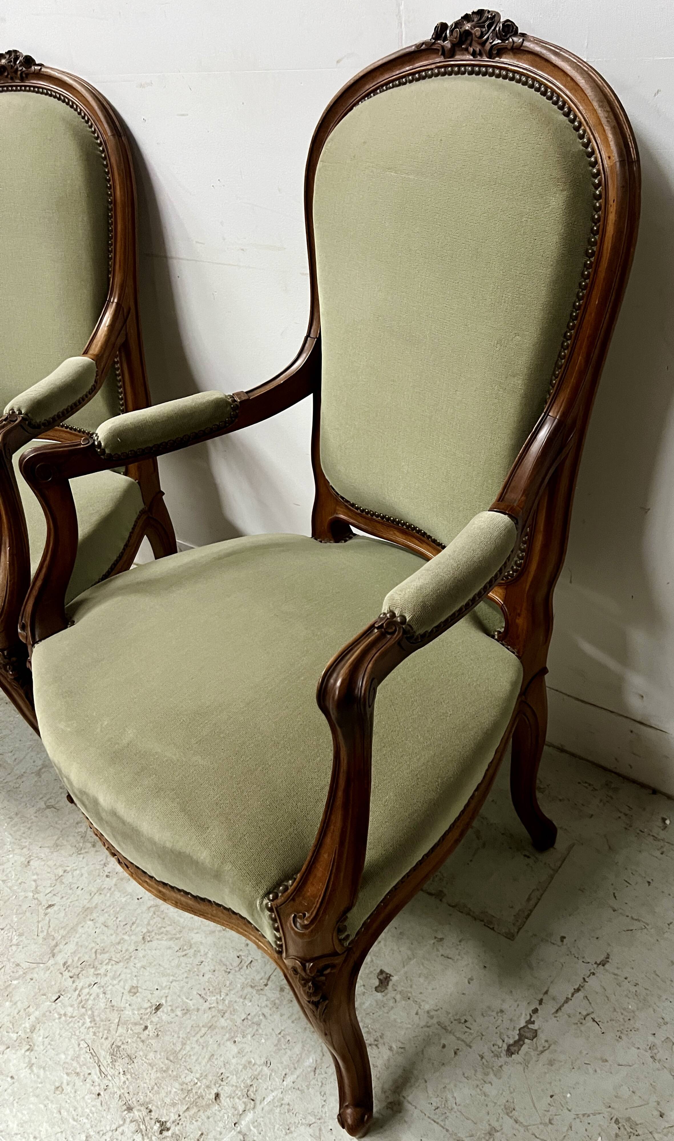 Pair of Louis XV style armchairs in solid walnut, 20th century.