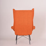 Orange Mid Century Modern armchair, made in 1960s Czechia