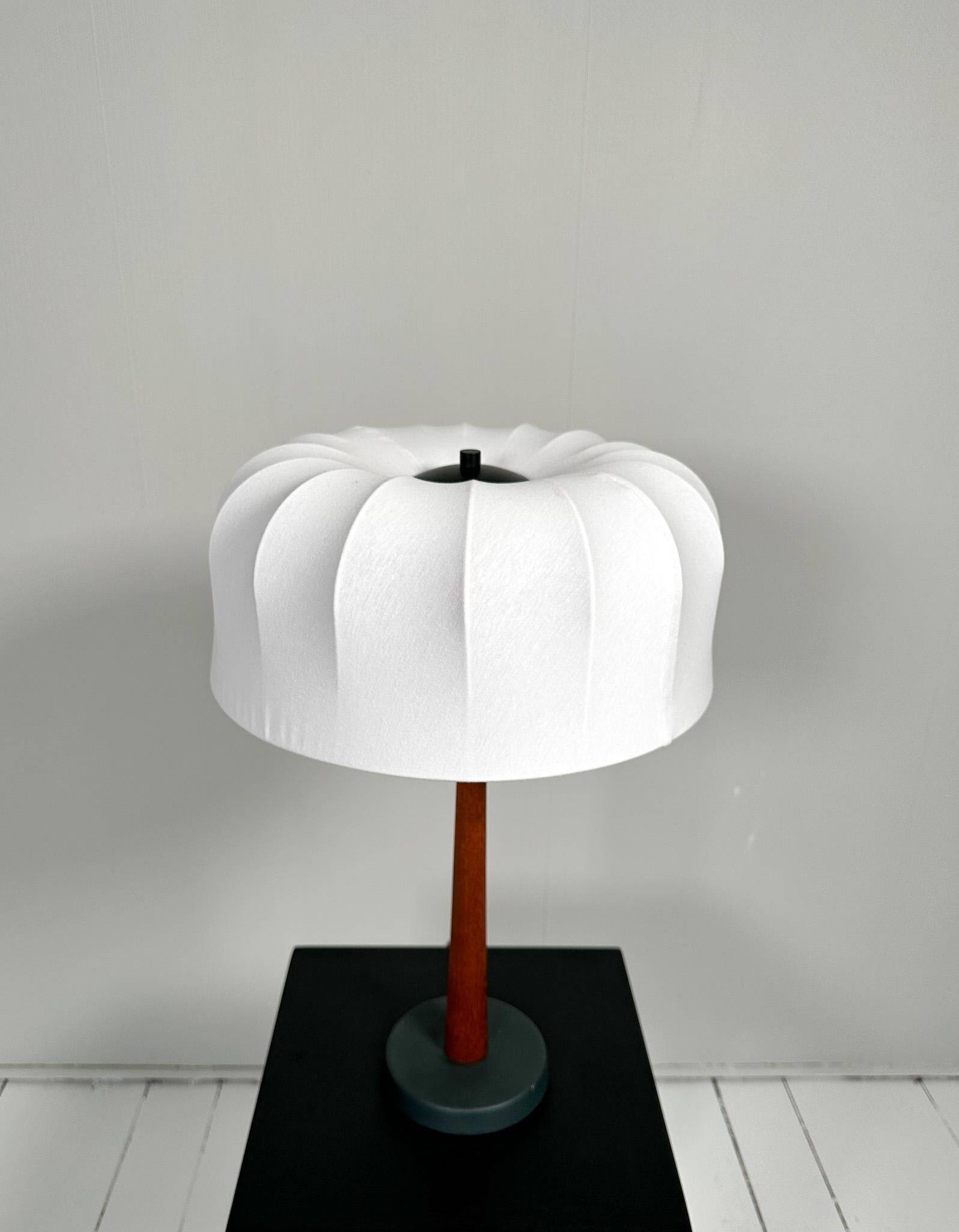 Mid-century teak and cotton table lamp by Einar Bäckström, Sweden, 1950s.