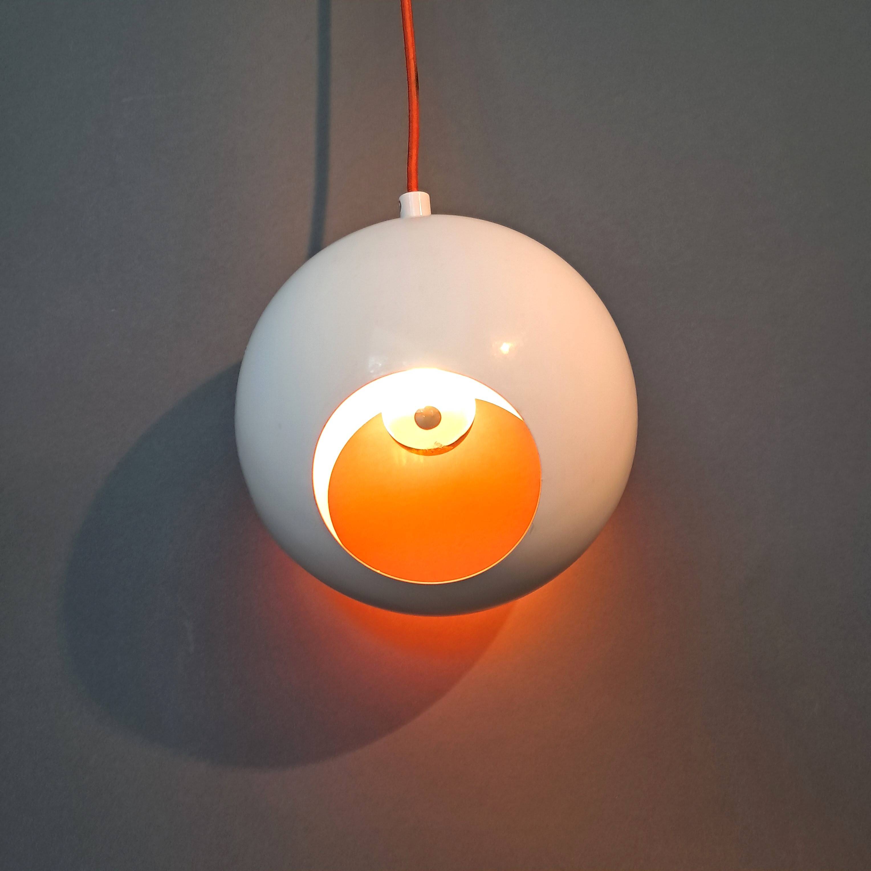White openwork pendant light with orange interior 1970/1980.