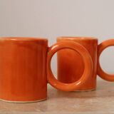 Handmade orange peach ceramic coffee mug set with large circular handles