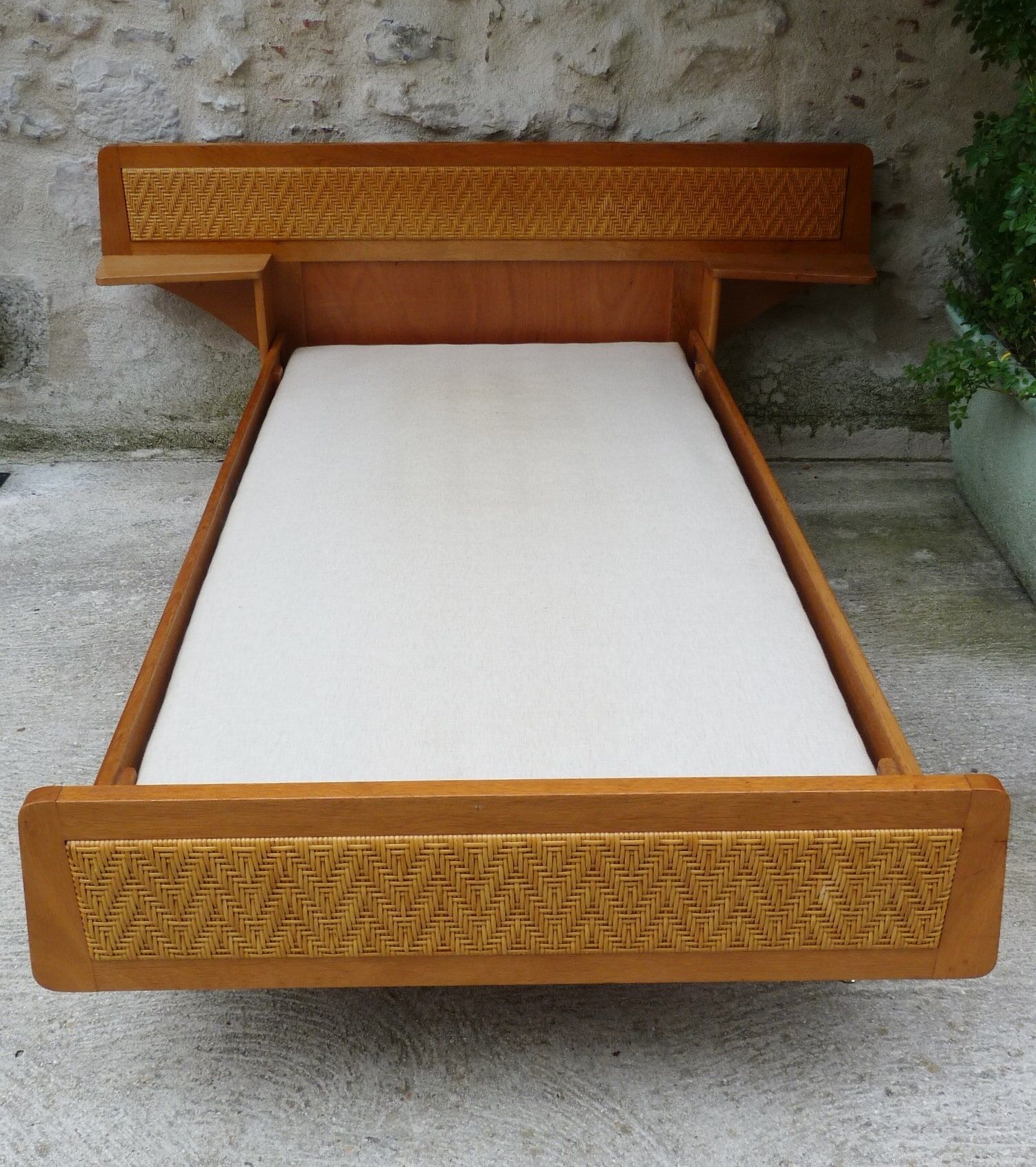 Wooden bed and rattan