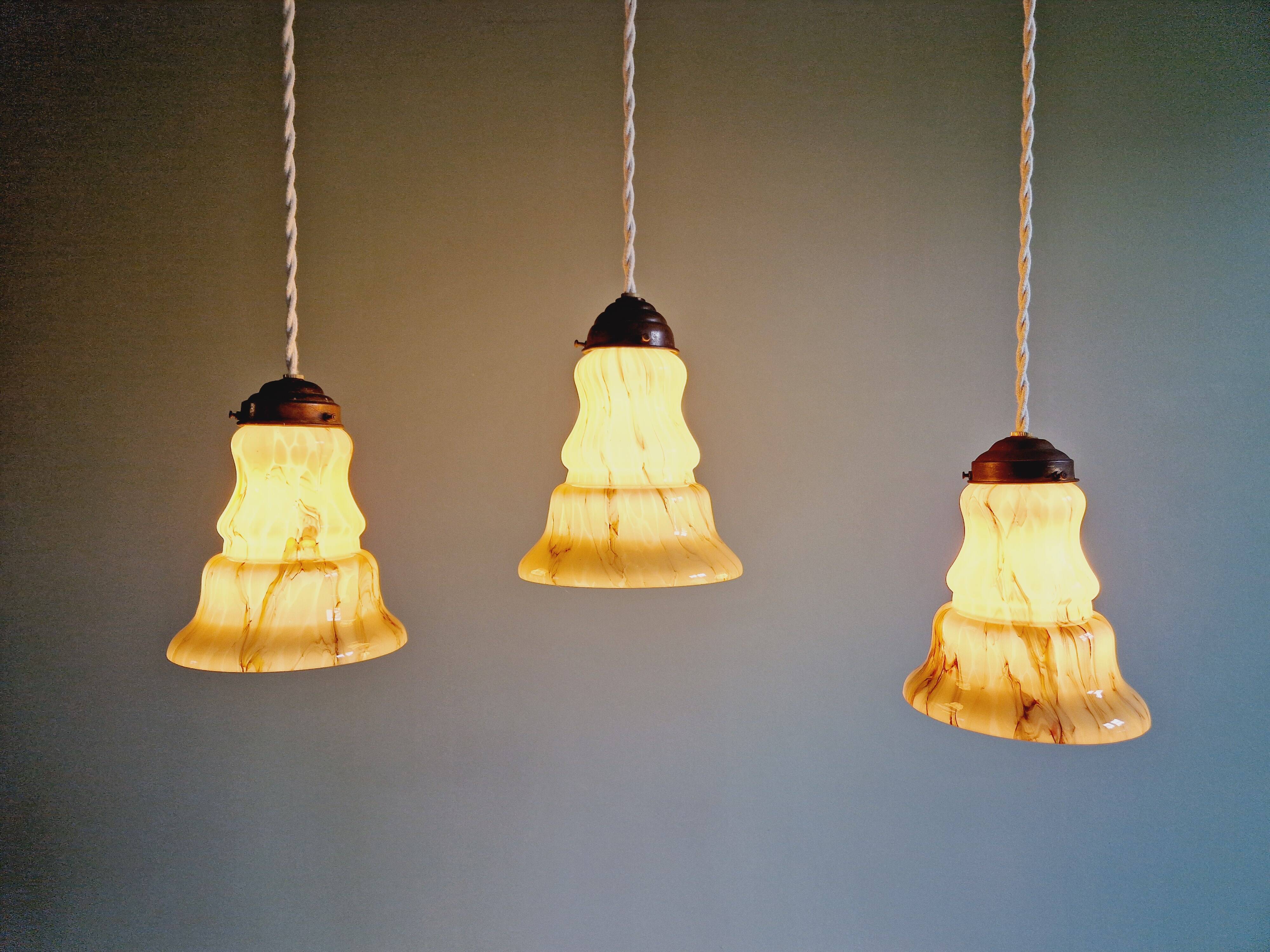 Set of 3 Art Deco marbled opaline pendant lights, 1920s-30s