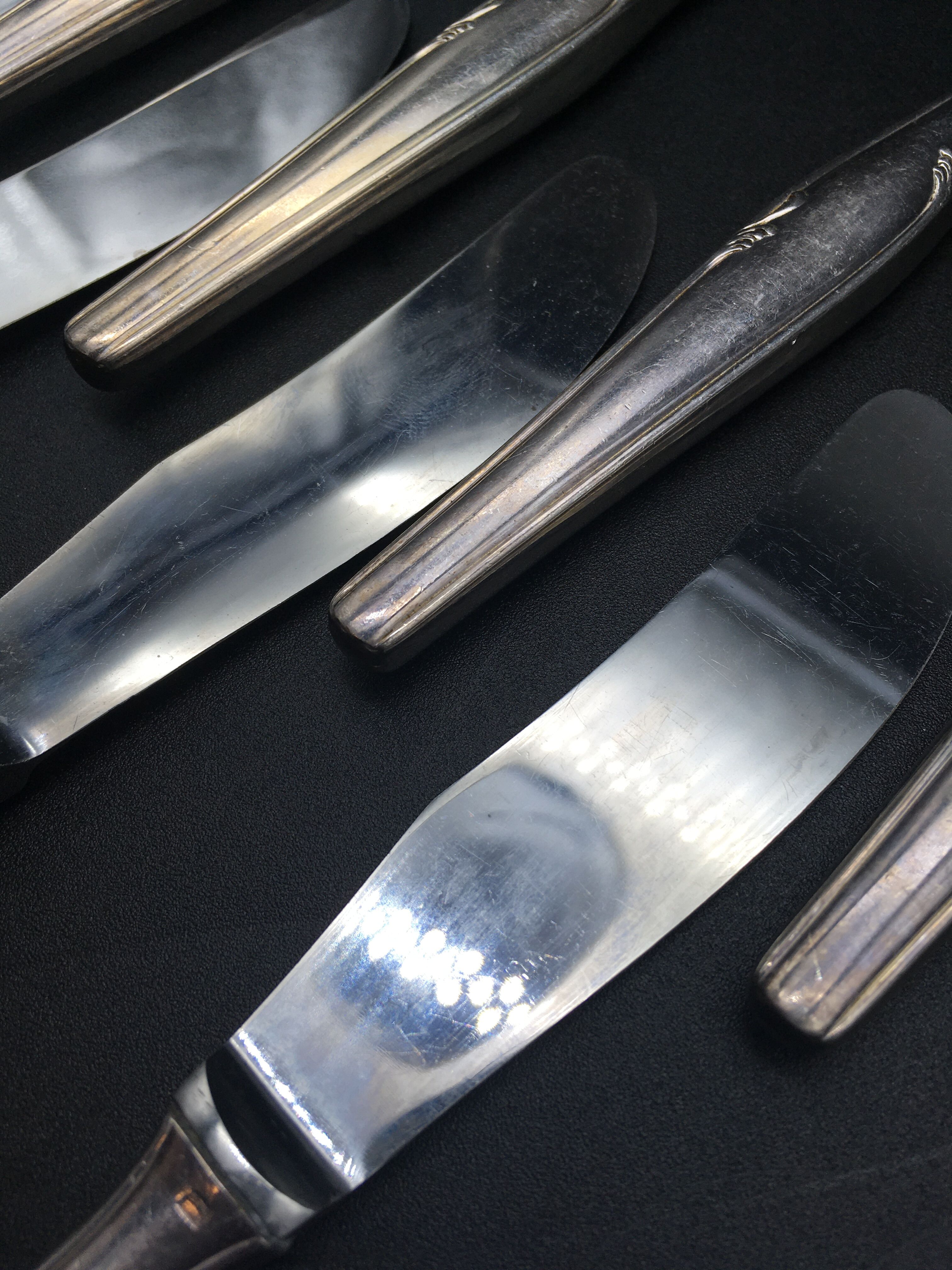 12 silver metal knives