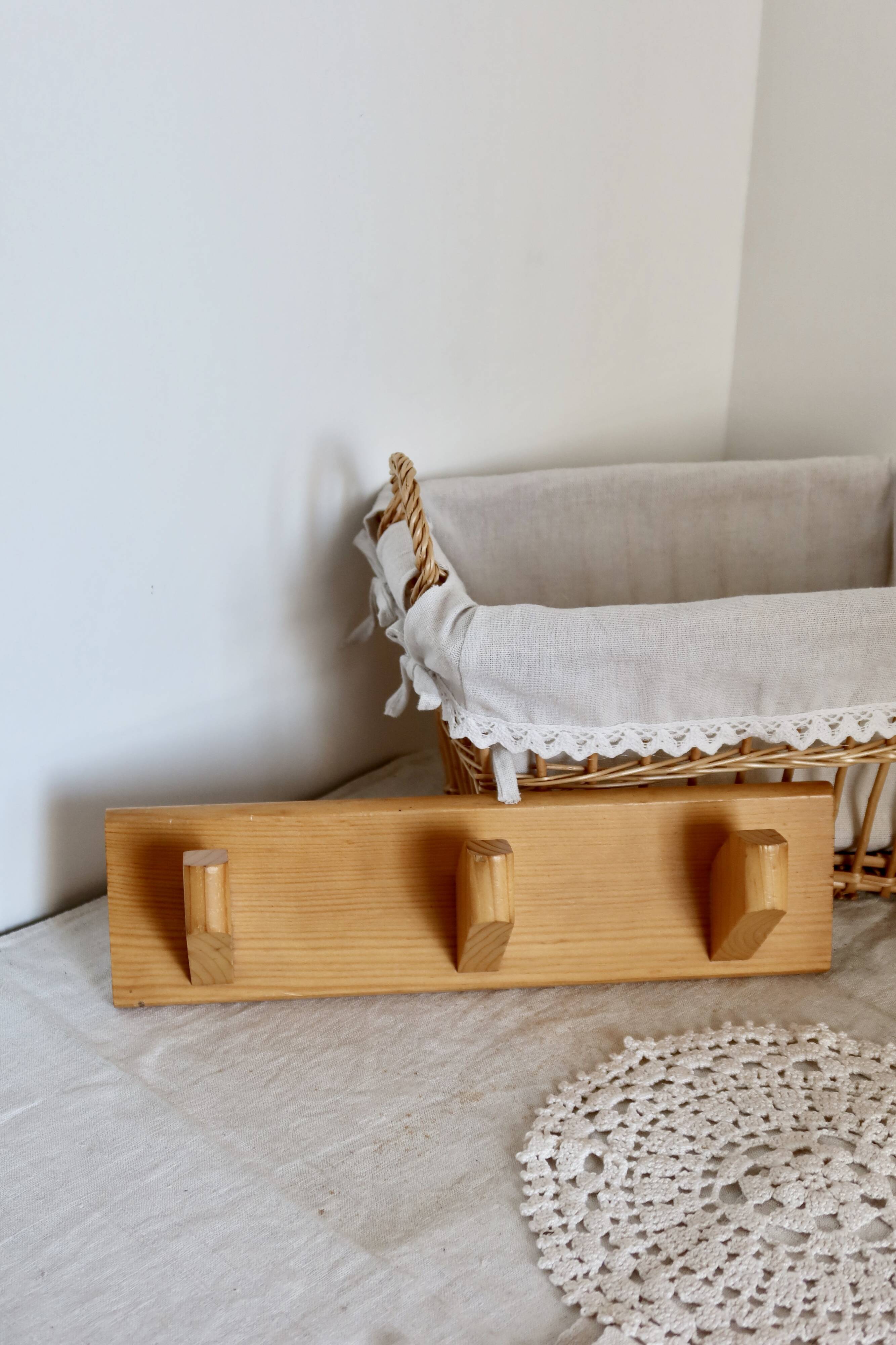 Vintage wall coat rack in pine with 3 hooks.