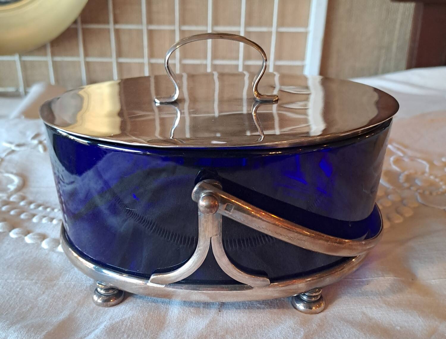 Silver-plated metal and blue glass biscuit jar