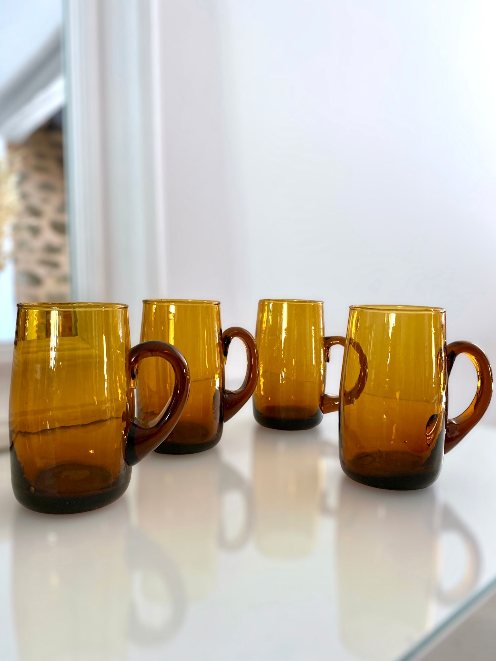 4 mugs/ mugs in vintage blown amber glass