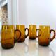 4 mugs/ mugs in vintage blown amber glass