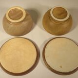 Two sandstone bowls and saucers