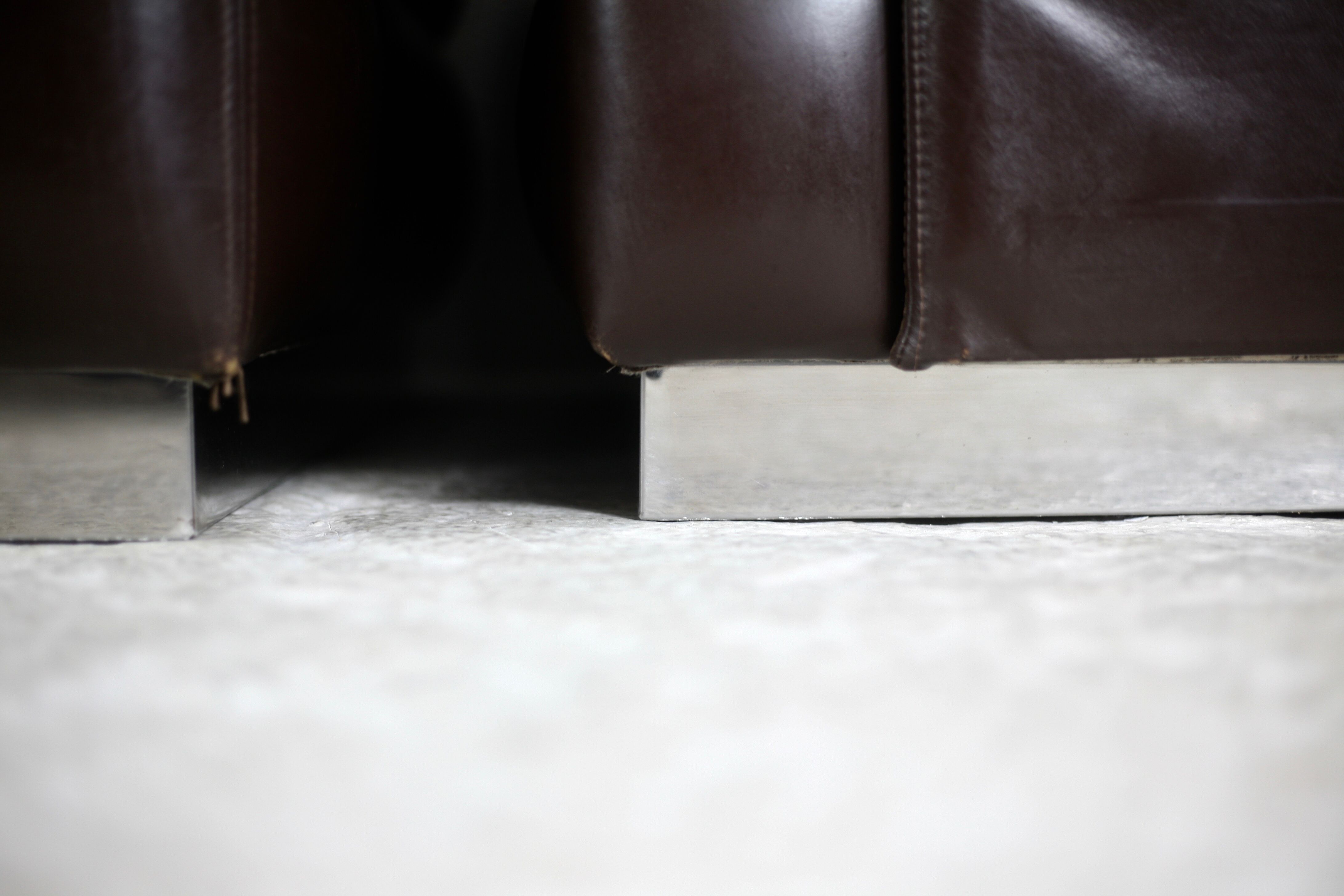 Pair of armchairs brown leather base stainless steel, France, circa 1970
