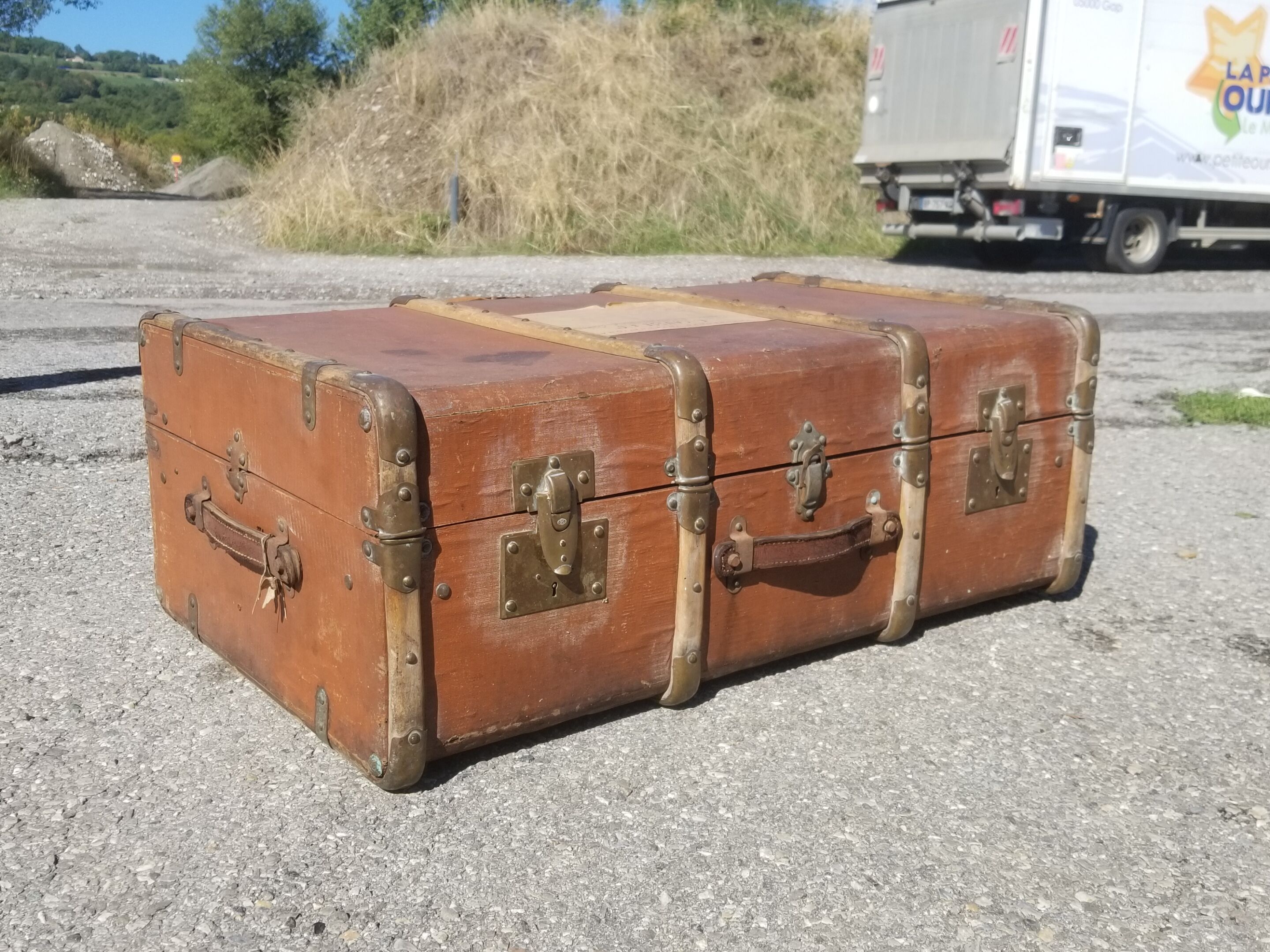 Old travel trunk made of wood and brass