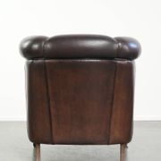 Dark sheepskin club armchair with unique design in English style