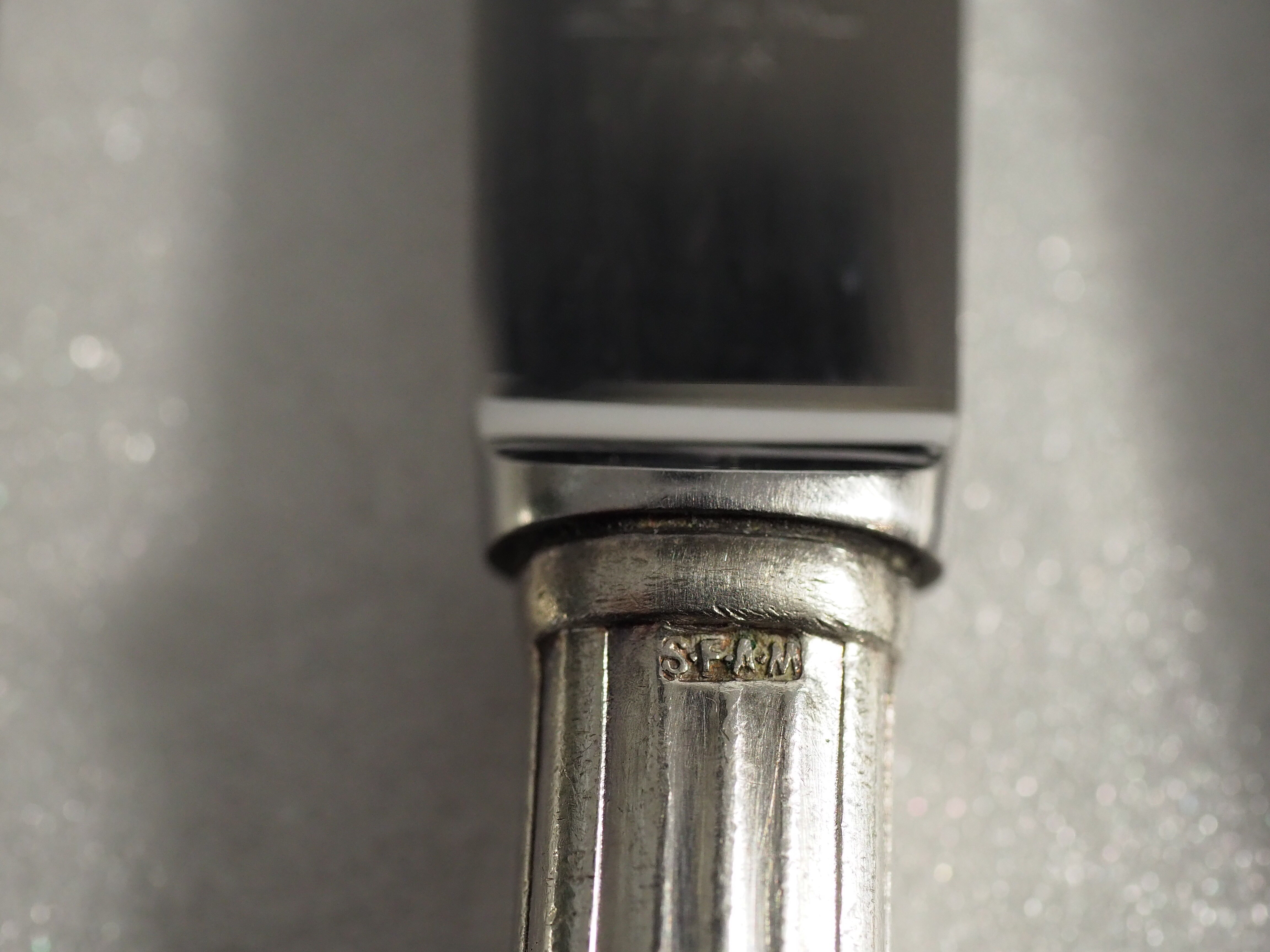 12 SFAM cheese knives in its dark chocolate case