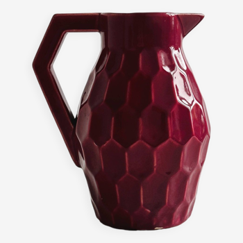 Old earthenware honeycomb pitcher jug.