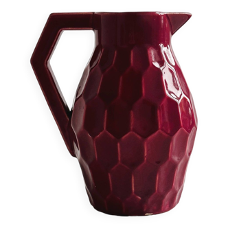 Old earthenware honeycomb pitcher jug.