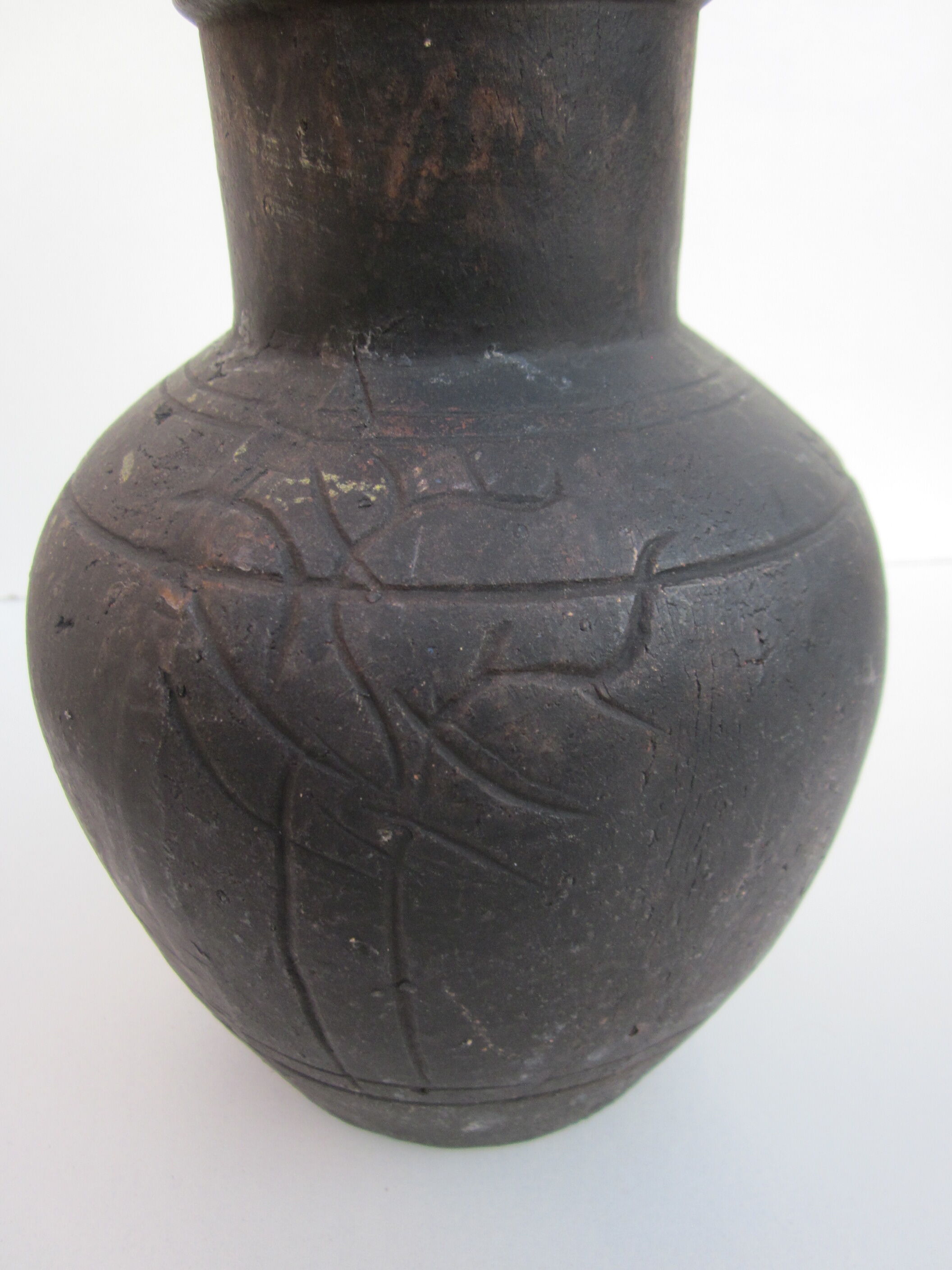 Black African pottery with stylized giraffe pattern