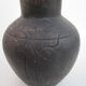 Black African pottery with stylized giraffe pattern