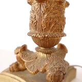 Empire period torch candle holder in bronze tripod base with lion's claws