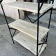 Industrial-style shelf in light wood and cast iron