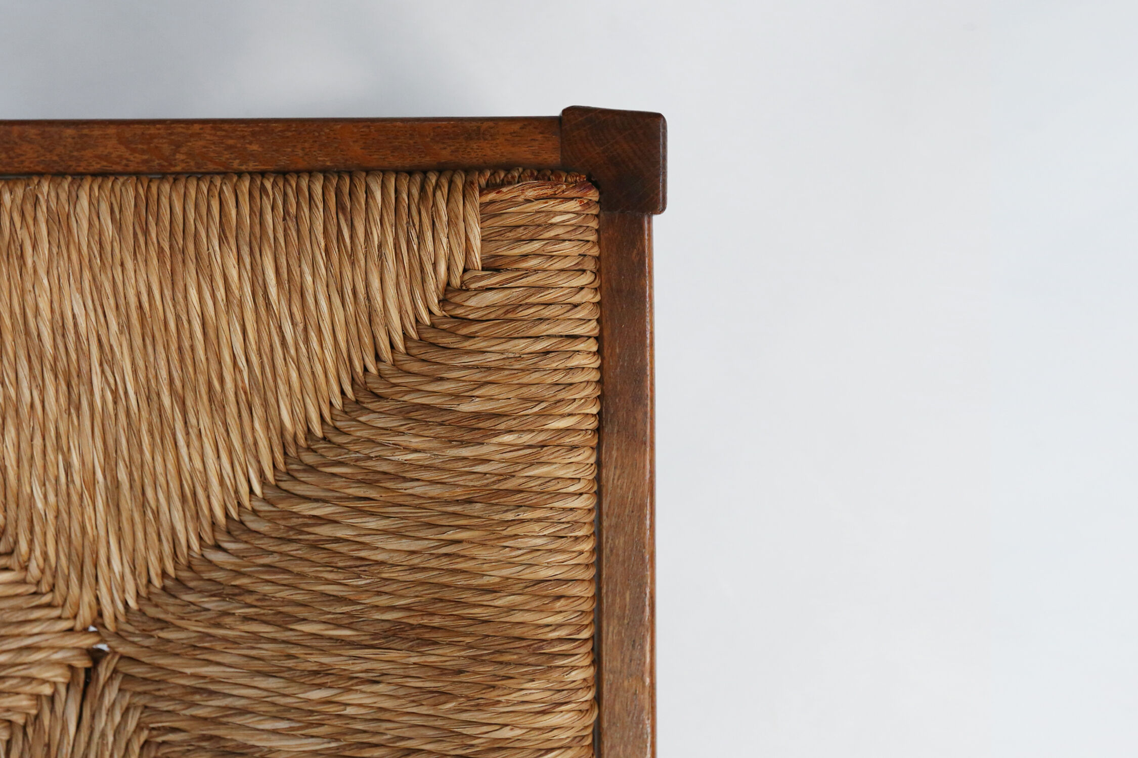 Set of six brutalist dining chairs in oak an wicker
