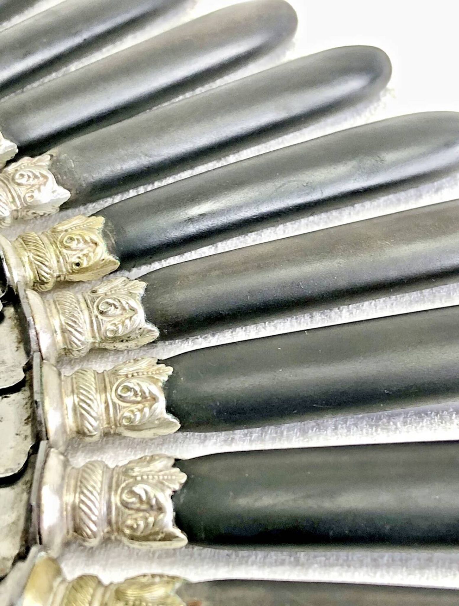 12 antique large table knives with ebony handles from the Napoleonic III period.