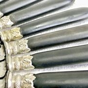 12 antique large table knives with ebony handles from the Napoleonic III period.