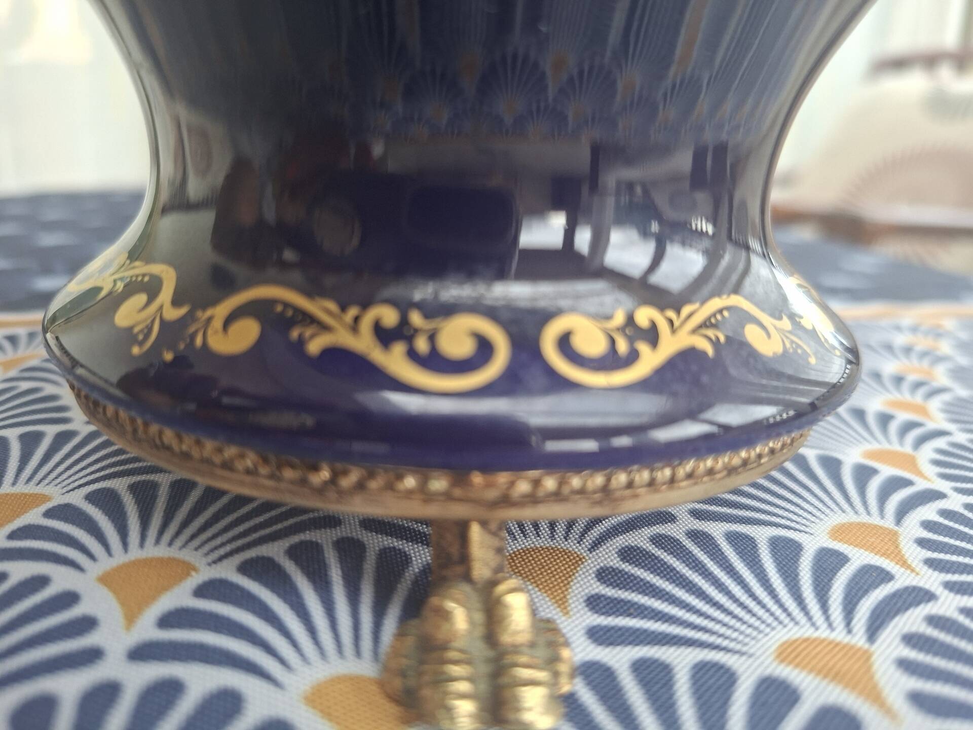 Cobalt blue porcelain bonbonnière with gold decoration on feet.