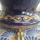Cobalt blue porcelain bonbonnière with gold decoration on feet.