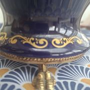 Cobalt blue porcelain bonbonnière with gold decoration on feet.