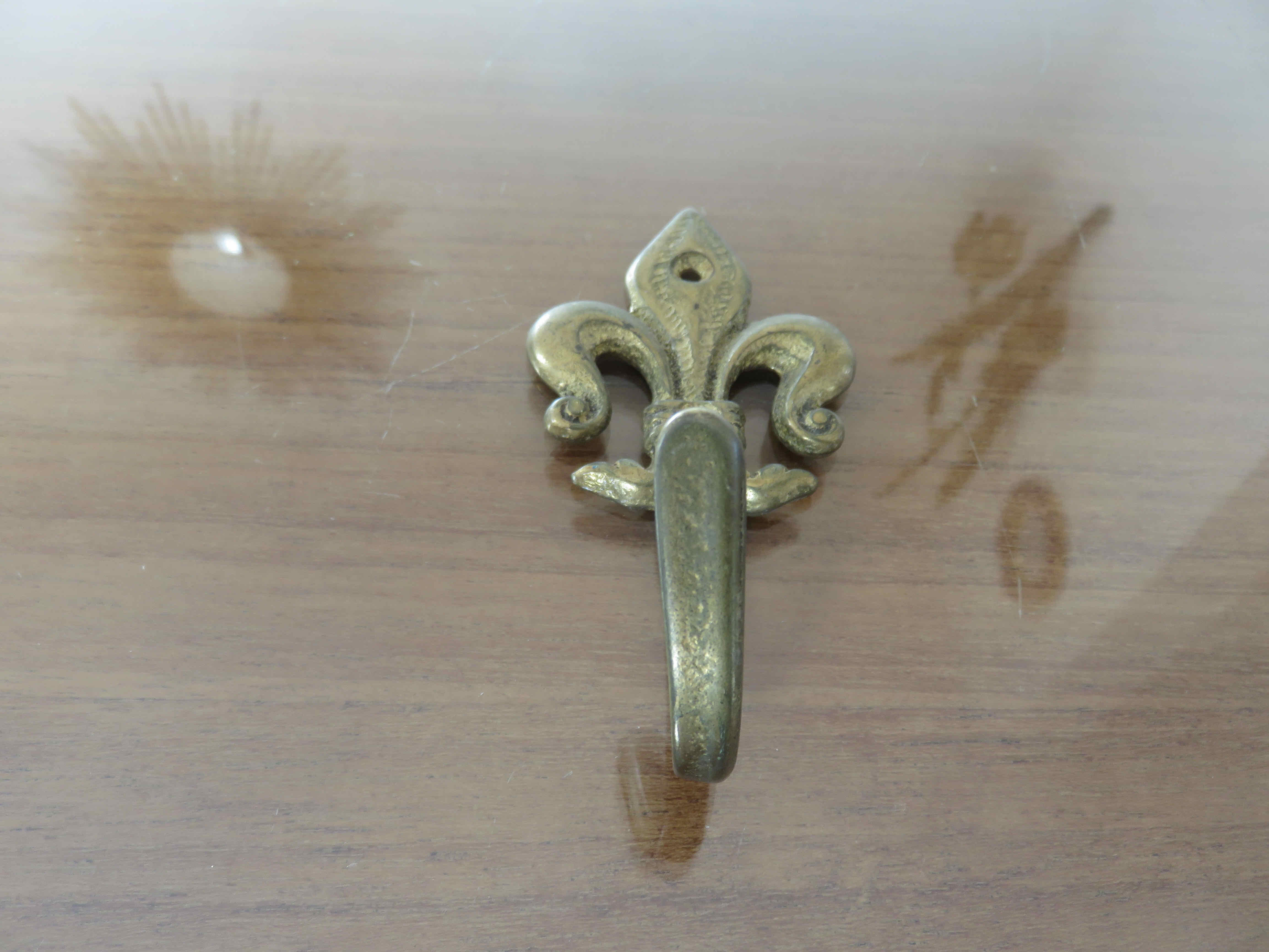 Brass "fleur de lys" hook 30-40s