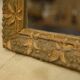 19th-century mirror in wood and stucco with floral decoration.