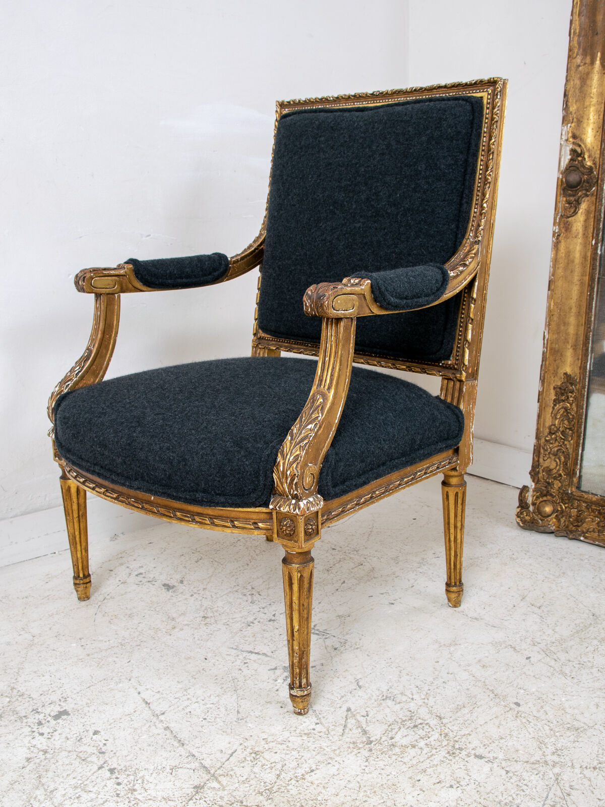 Pair of 19th century Louis XVI gilt armchairs newly re upholstered in holland and sherry fabric