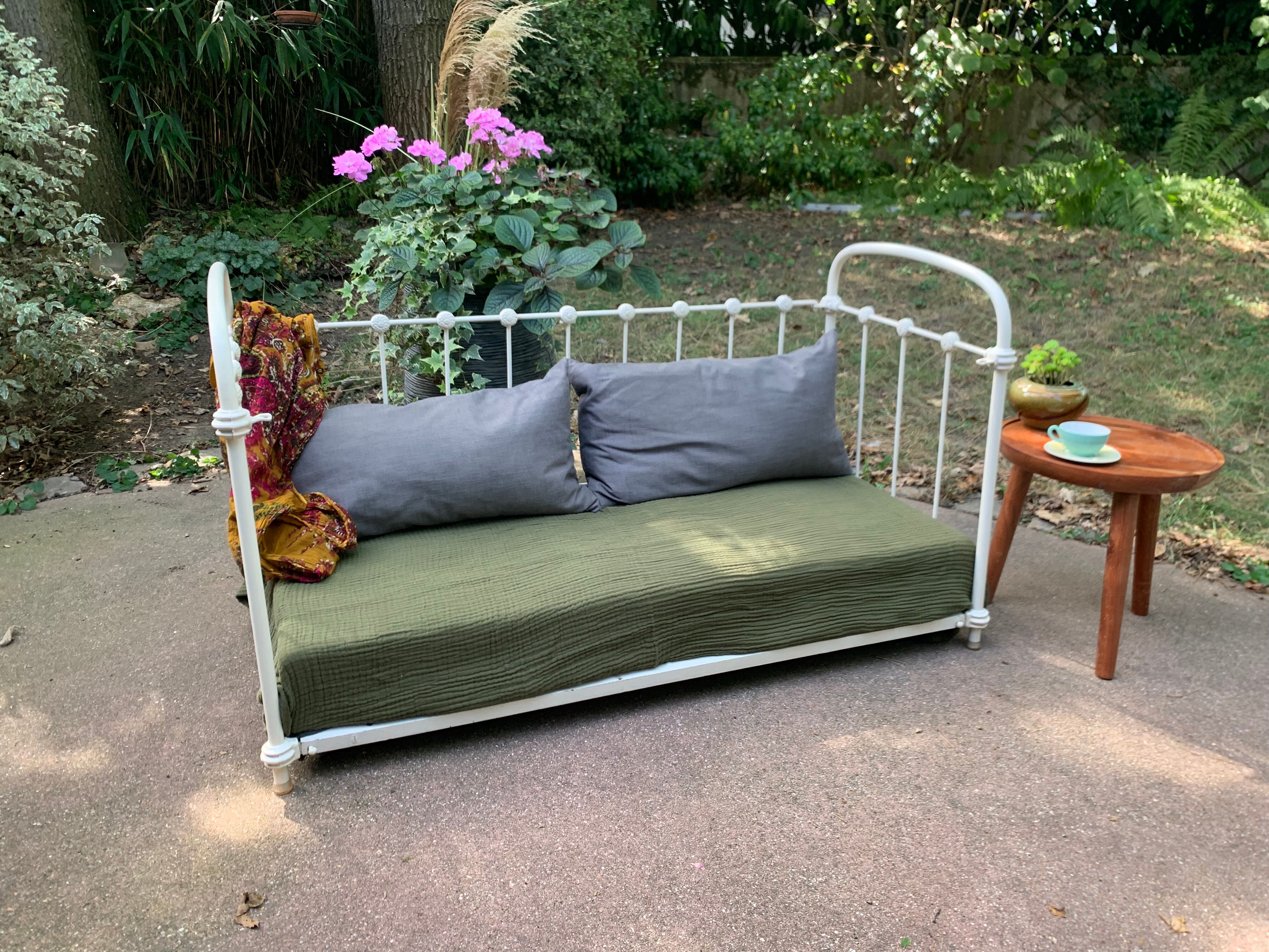 Wrought iron sofa bed with box spring.
