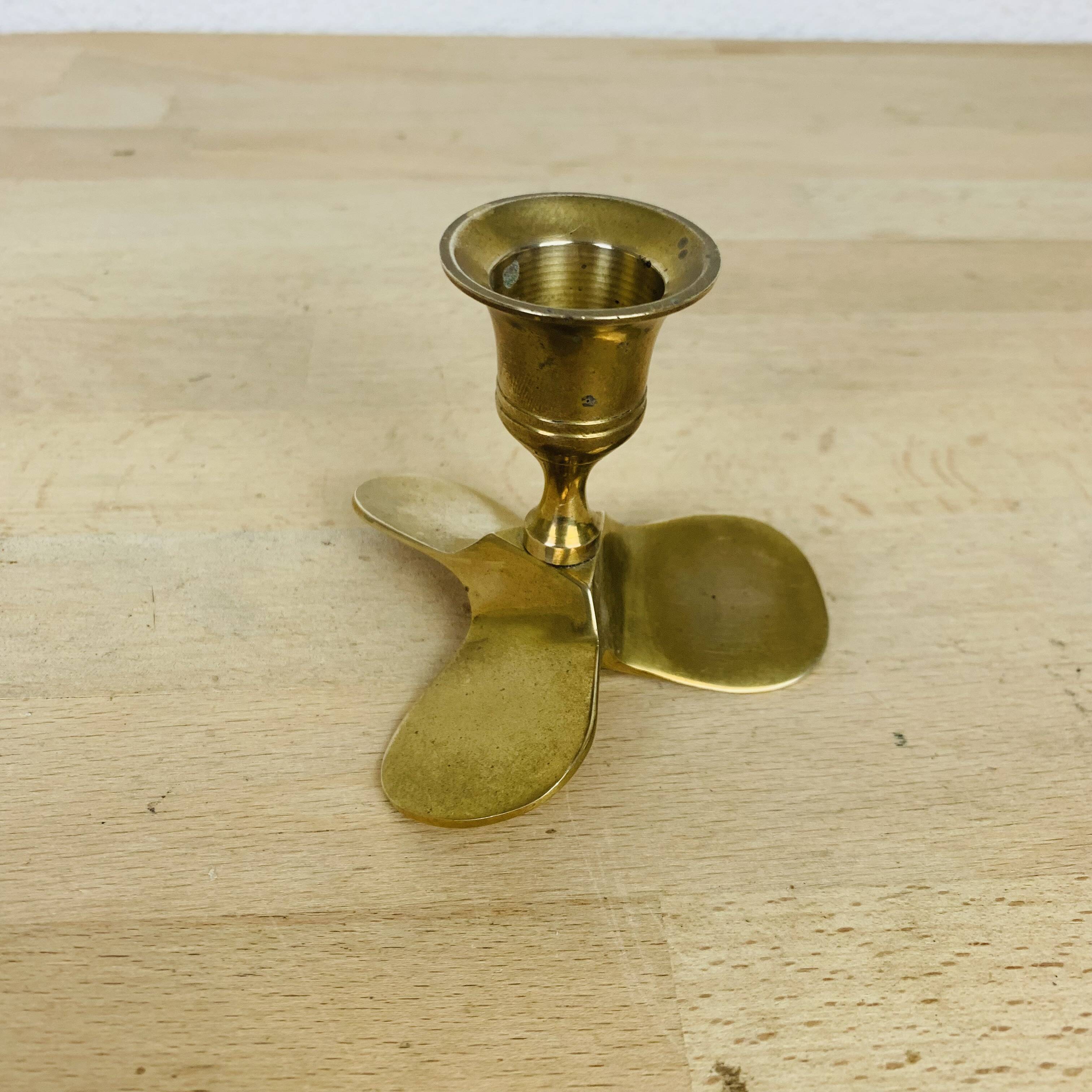 Golden brass propeller candle holder