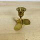Golden brass propeller candle holder