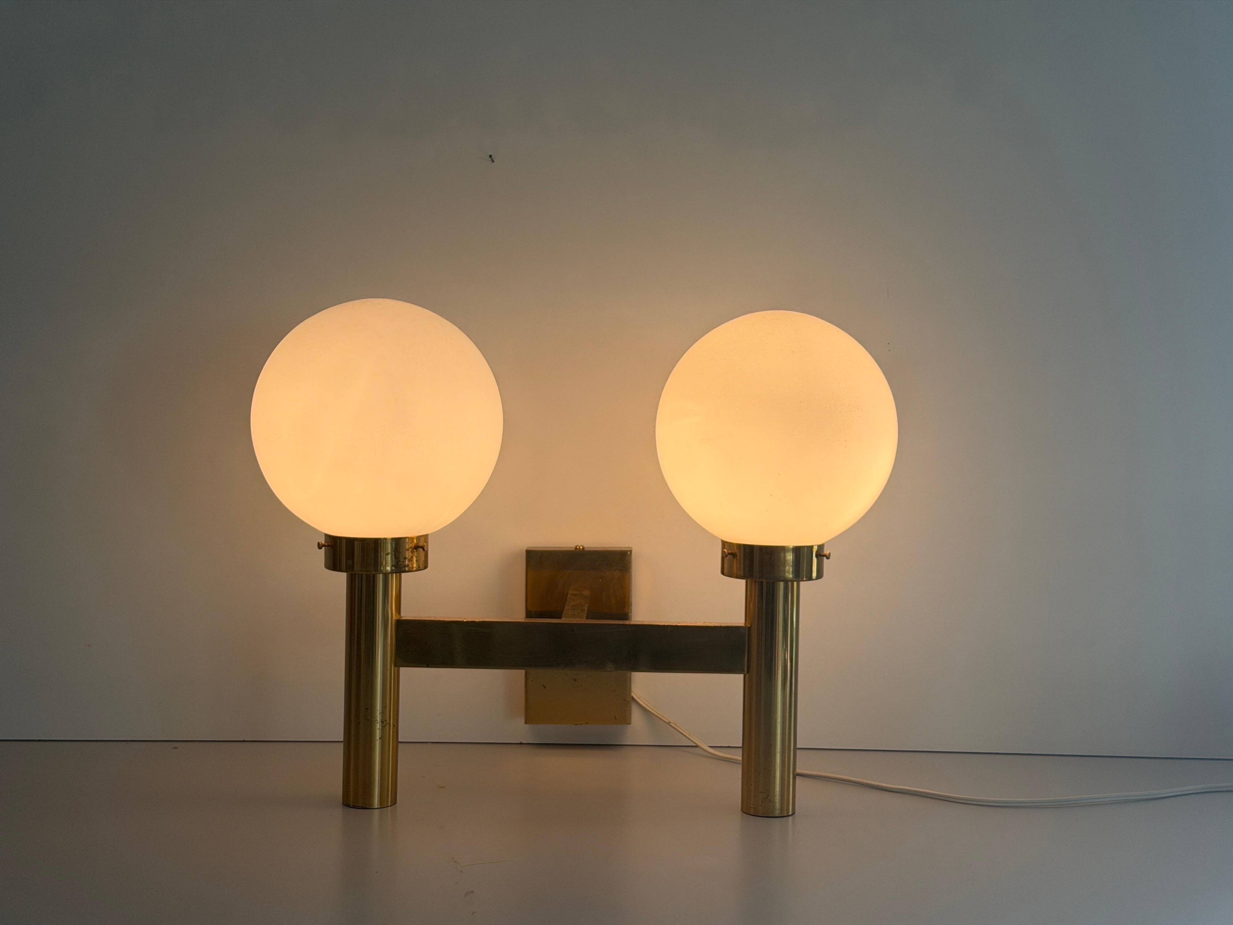 Double opal glass and heavy brass, large minimalist cinema wall light, 1960s, Germany