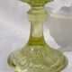 Old small cut on foot in yellow molded glass