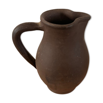 Ancient pitcher in earth