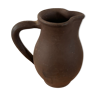 Ancient pitcher in earth