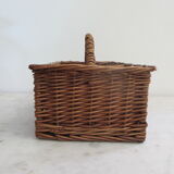 Basket carries glasses or cutlery in wicker.