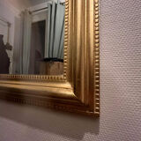Gilded mirror with moldings