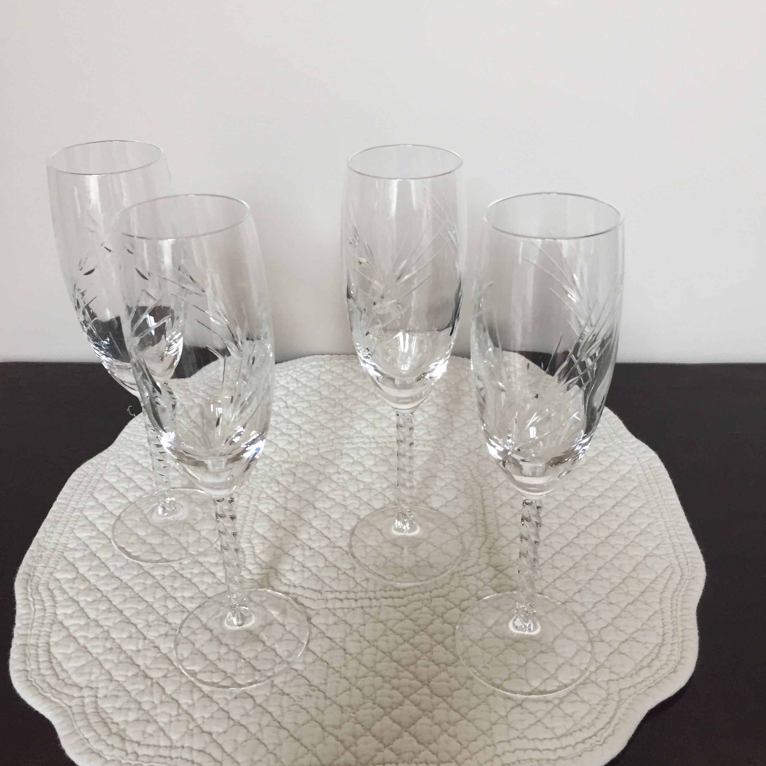 Four crystal champagne flutes engraved wheat cob patterns