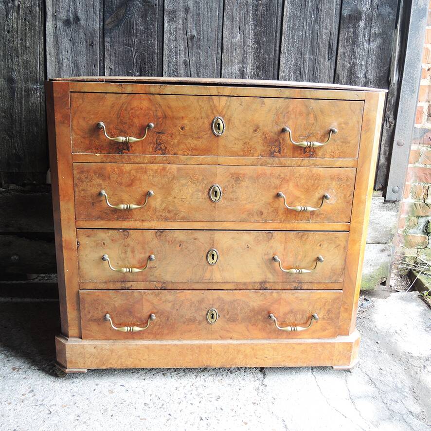 Old wooden chest of drawers with 4 drawers on wheels