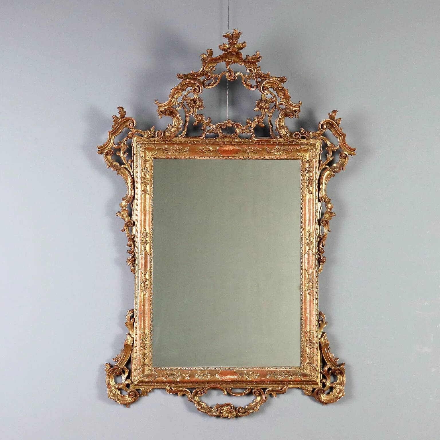 Antique carved and gilded wooden mirror, Italy, early 20th century.