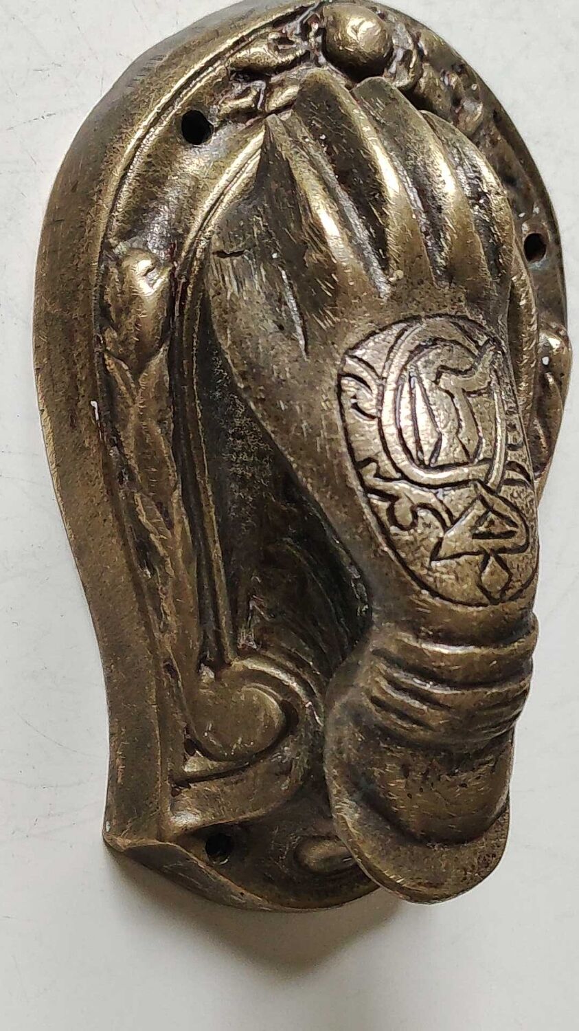 Door knocker in bronze