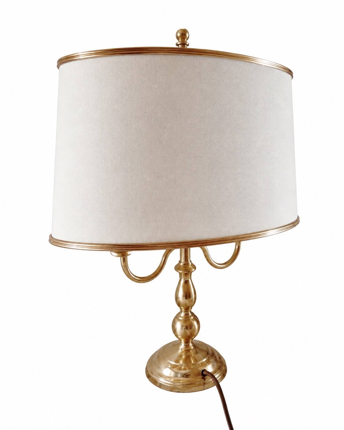 Empire style brass bouillotte lamp with an ivory oval shade.