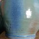 Enamel pitcher in pastel blue and green, signed