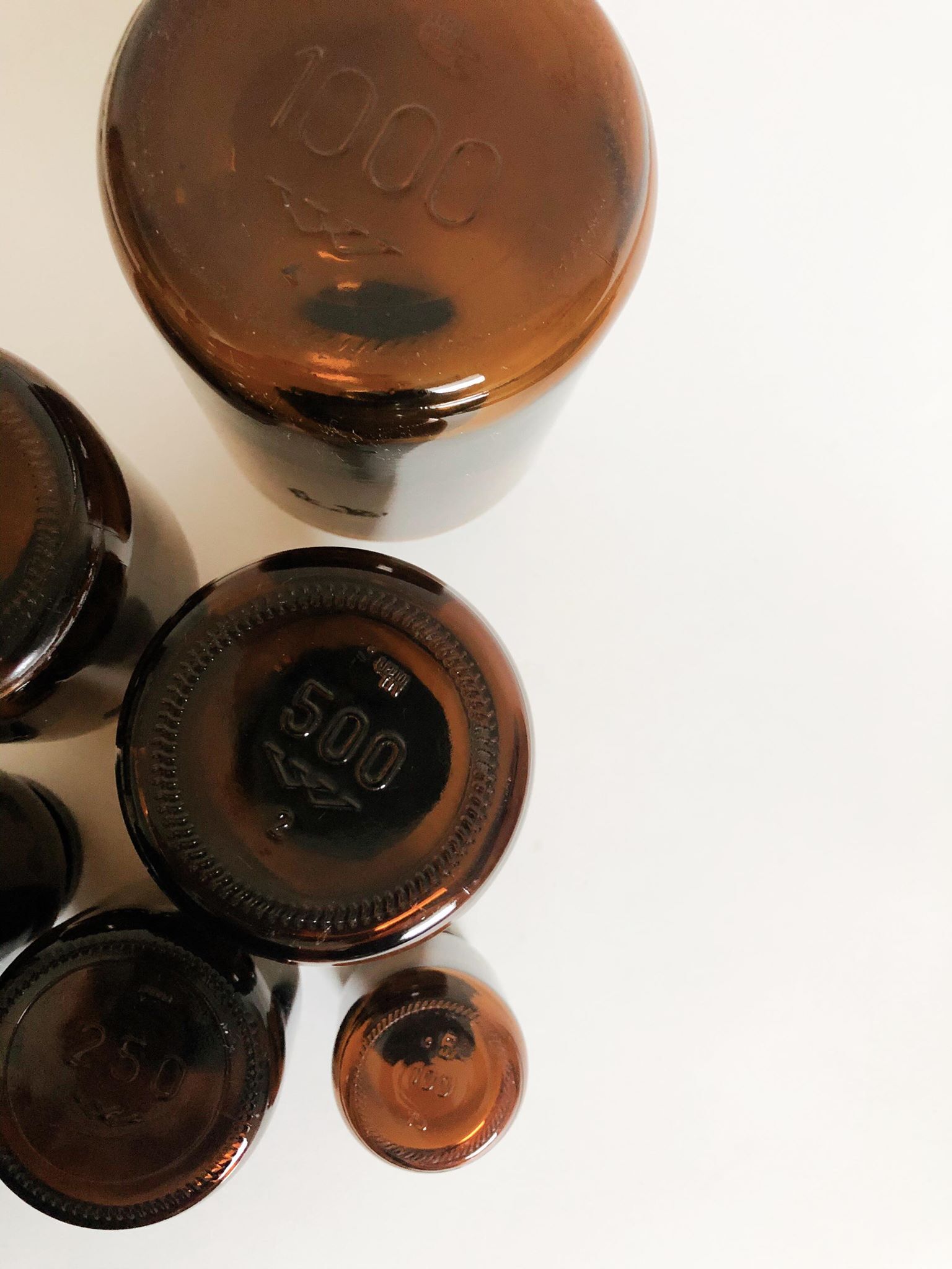 Lot of 7 bottles of amber glass apothecary style