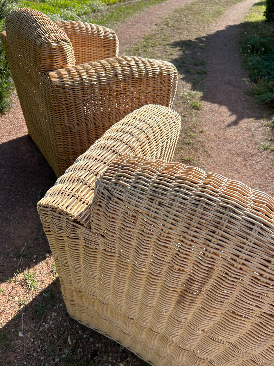 Large rattan armchairs