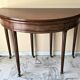 Extendable half-moon table in Louis XVI style